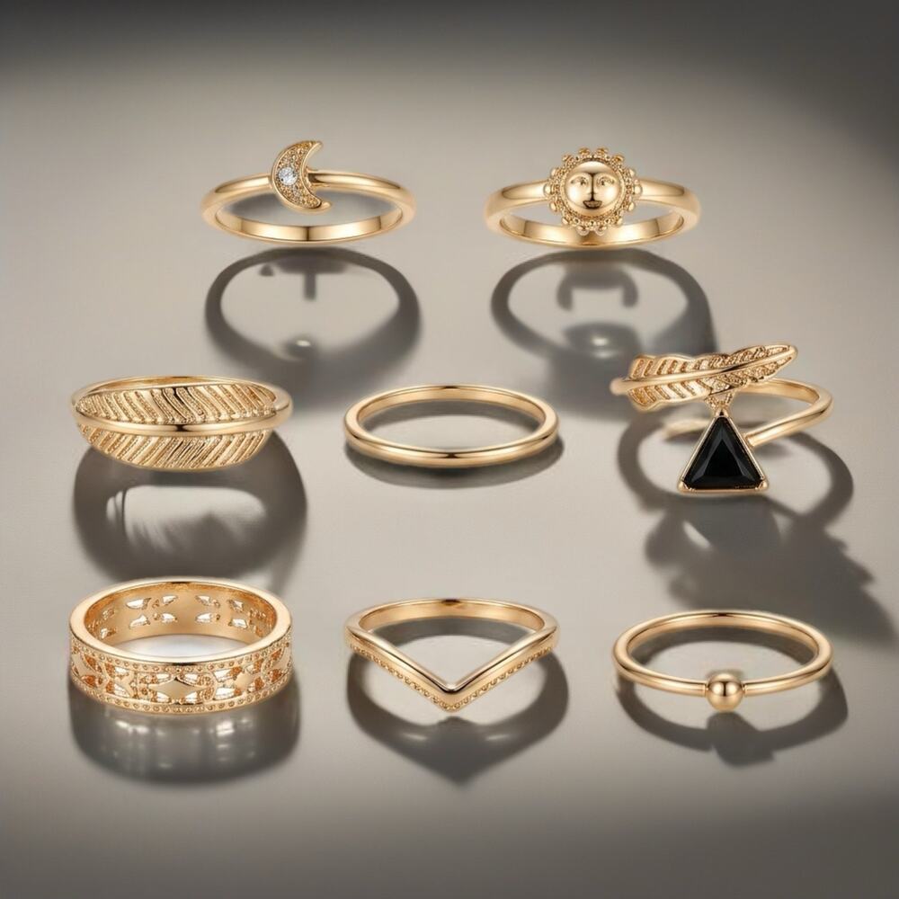 7-Piece Gold Tone Stackable Ring Set Sun Moon Feather and more Size 6.5- 7